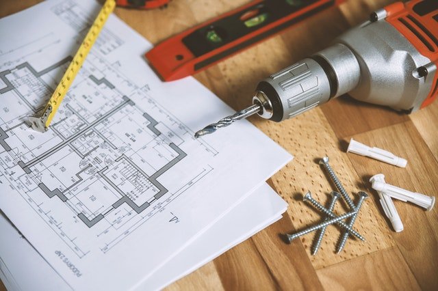 Construction equipment illustrating property maintenance costs for Saskatoon property management